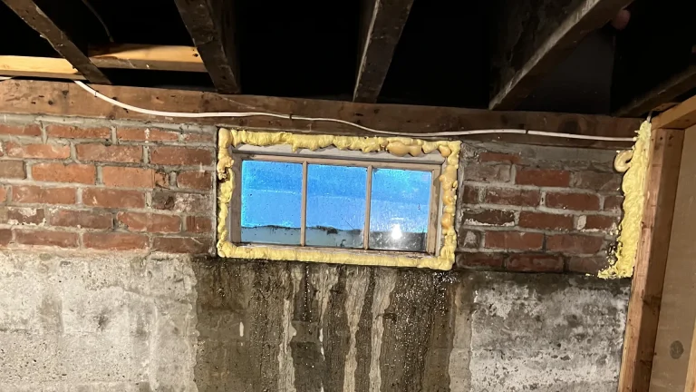 a window on a brick wall